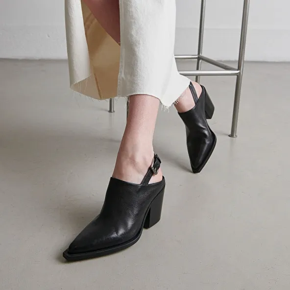 Mules with beveled heels in black leather